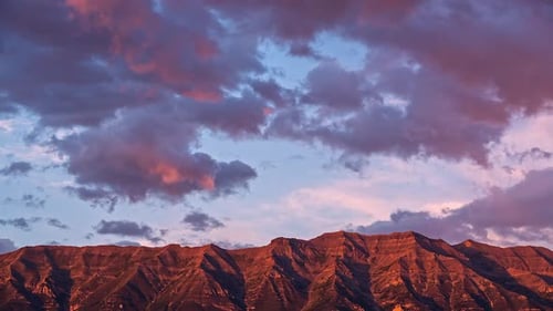 Sunset timelapse as light glows on mountain top in Utah