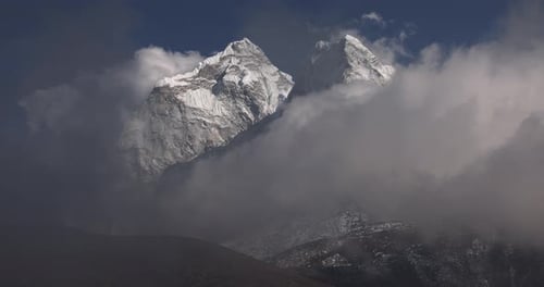 Slow motion clouds over the mountain peaks in Nepal, Himalayas.
