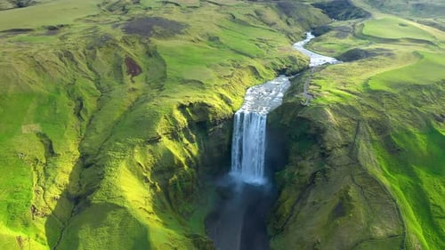 Slow motion aerial view of Skogafoss waterfall, Iceland