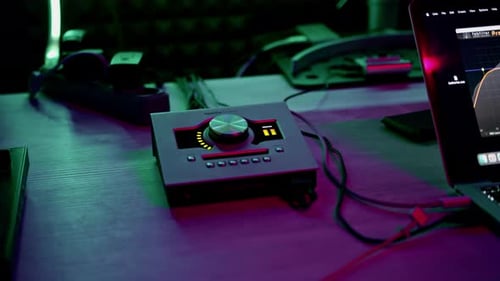 professional recording studio sound engineer finger adjusts sound volume level on mixer console