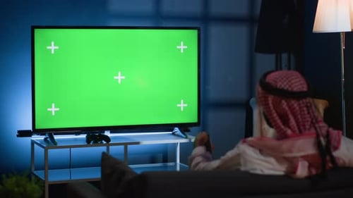 Man Watching Green Screen TV