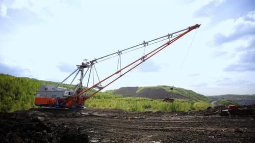 Giant Excavator Dumping Soil in Rural Landscape