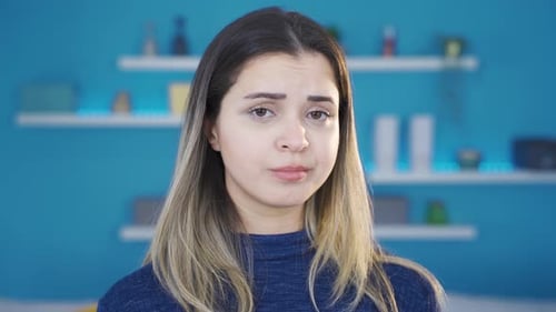 Portrait of depressed and unhappy young woman.