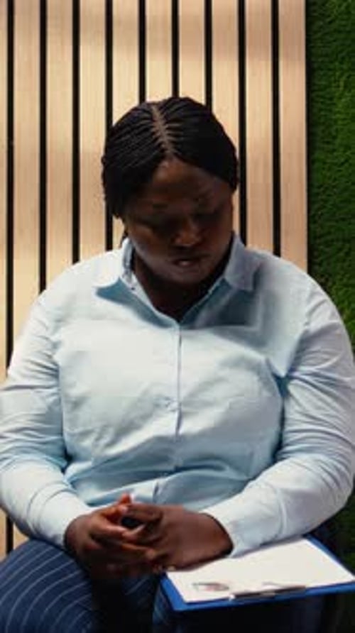 Vertical Video Anxious Diverse Job Seekers Awaiting Job Interview Discussion with Manager