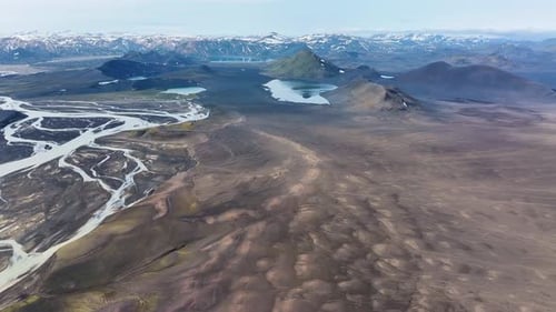 Snowy peaks of Icelandic highlands and mountains in summer. Aerial wide shot. Panorama view of volca