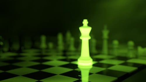 Greenlit King Chess Piece Stands on a Dark Checkered Board Other Pieces Blurred in the Background