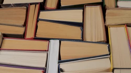 Books Stacked Together in a Close Up Pan