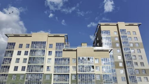 Tall Residential Building with Panoramic Windows Against Sky