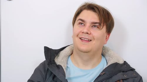 Excited Man Smiling and Gesturing Enthusiastically