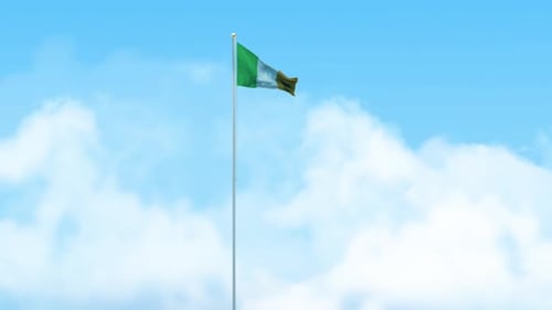 Irish National Flag Waving Against Blue Sky
