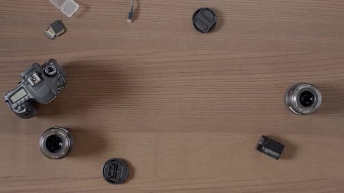 Photography Equipment Arranged on Wood Surface, Top Shot
