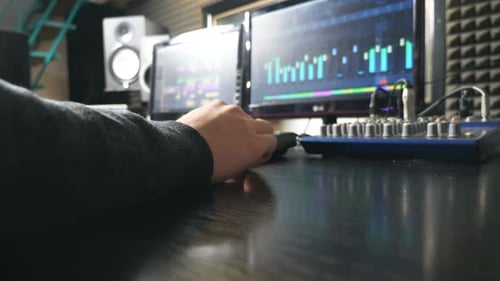 Unrecognizable Musician Composes Song Using Drum Machine in Recording Studio Male Hand of Sound