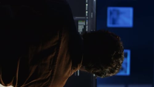 IT Specialist in Home Office Enjoying Hot Beverage While Programming