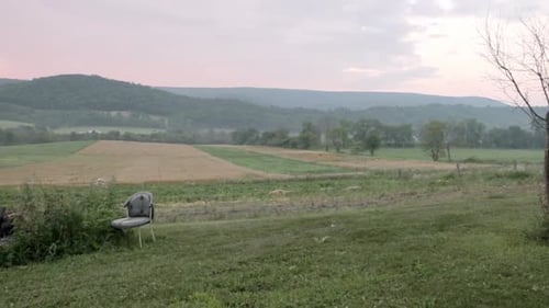 Mountain sunset over farmland Mountain sunset over farmland