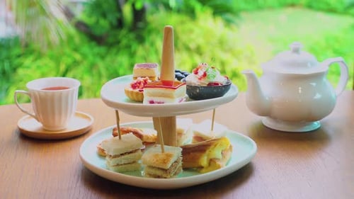 Afternoon Tea Stand with Assortment of Sweets Cakes Sandwiches