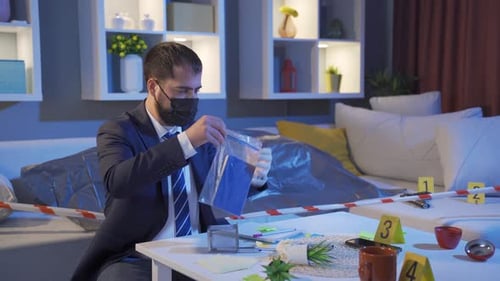 Forensic Investigator Collects Evidence at Crime Scene