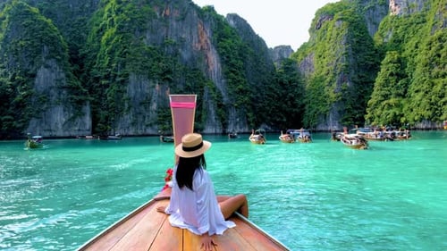 Pileh Lagoon with Green Emerald Ocean at Koh Phi Phi Thailand Women in Front of Longtail Boat
