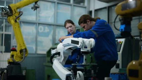 A group of Robotics engineers working with Programming and Manipulating Robot Hand