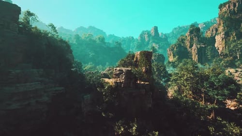 A Mountain Landscape with Trees and Rocks in the Foreground