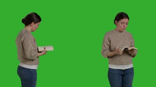 Konzentriertes Halten eines Aktionsbuches für Erwachsene und Lesen im Studio