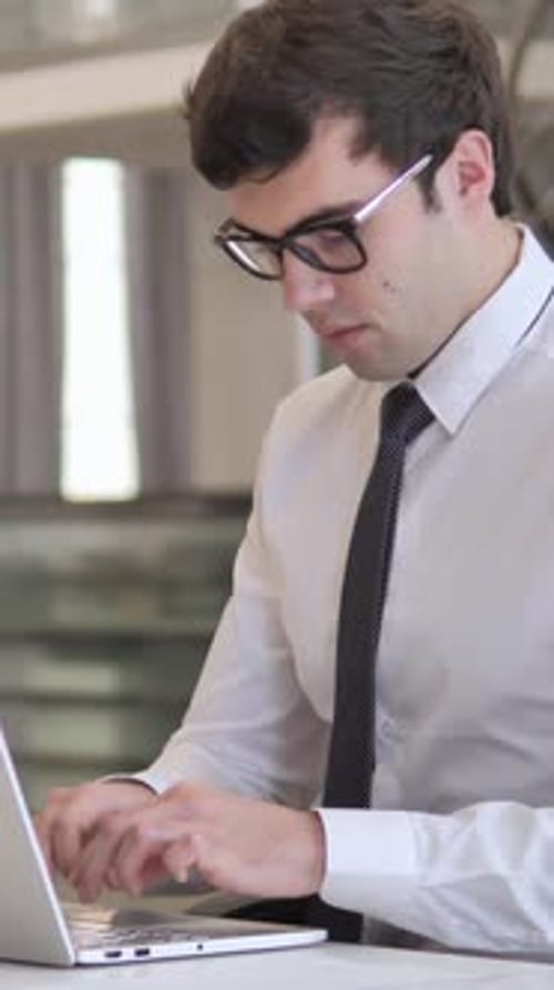 Smiling Businessman Looking at Camera in Office, Vertical Video