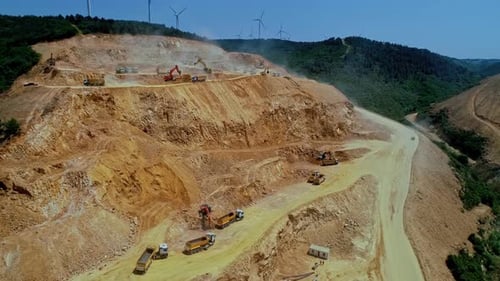 Construction Site with Heavy Machinery in a Rural Landscape