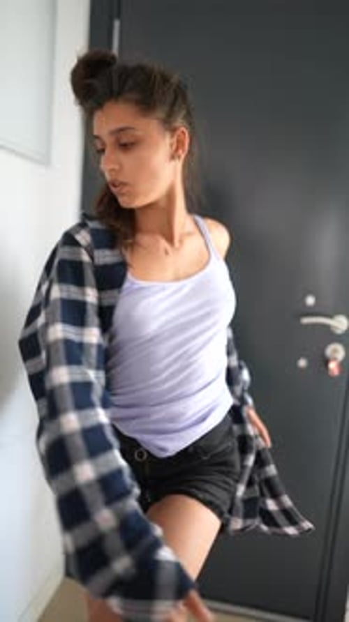 Young Woman Posing and Dancing Indoors