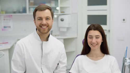 Dentist and Patient Smiling in Modern Dental Office