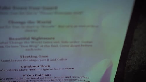 A close up of a concert set list.