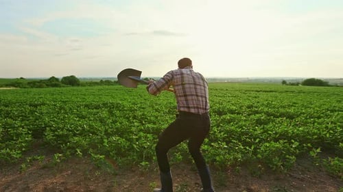 Male Farmer Working on Field Dancing Jumping
