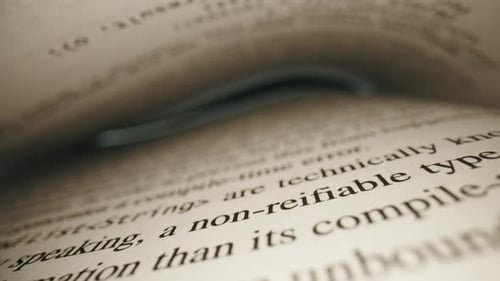 Detailed Close-Up of Book Pages with Text