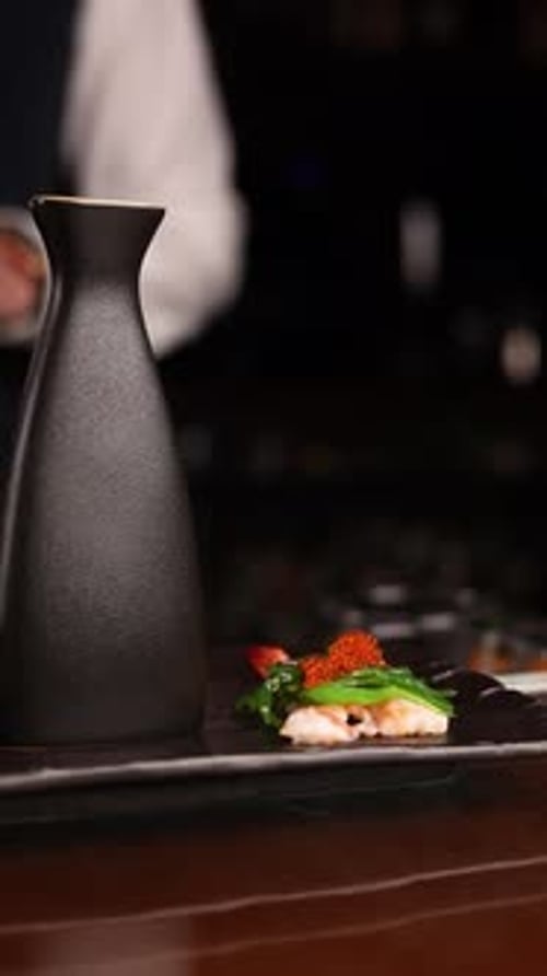 the bartender prepares a popular cocktail at the bar