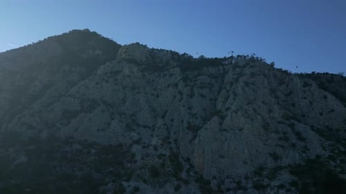 The Camera Flies From Below to the Top of the Mountain to the Funicular