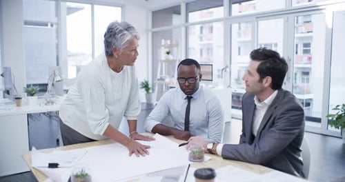 Team Discussing Business Strategy in Modern Office