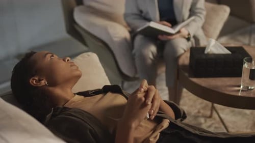 Woman Lying on Couch During Therapy Session