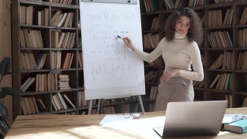 Tutor Explains Math Problem in Home Library