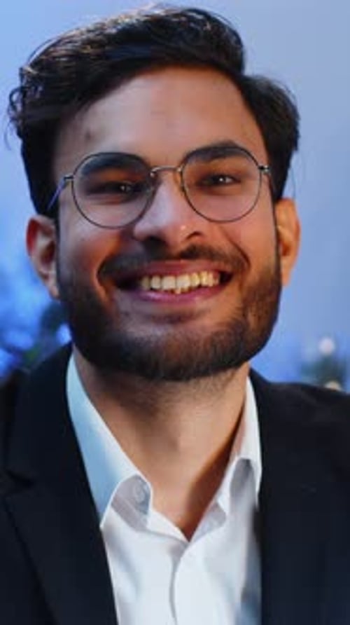 Portrait of Happy Smiling Bearded Indian Business Man at Home Office Look Away Turn Head at Camera