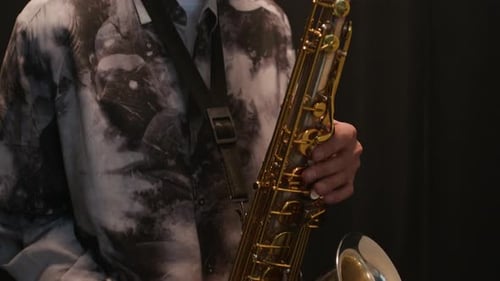 Concentrated Male Musician Playing Saxophone Indoors