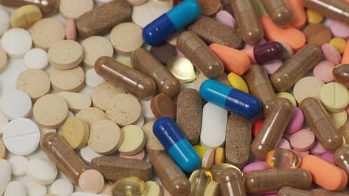 Pile of Colorful Pills and Capsules Close Up