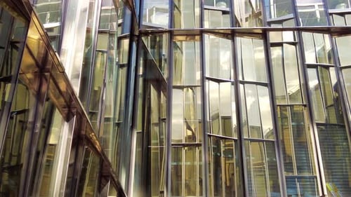 Modern Glass Building With Reflections in City