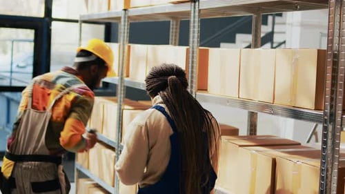 Warehouse Employees Scanning Retail Products on Racks