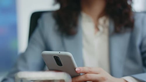 Woman Hands Scrolling Mobile Phone Sitting Office Closeup Lady Looking at Phone
