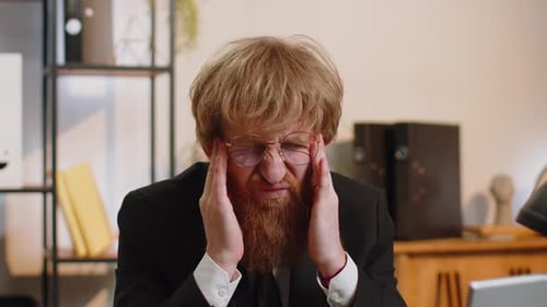 Tired Young Business Man Suffering From Headache Problem Tension Migraine Stress at Home Office