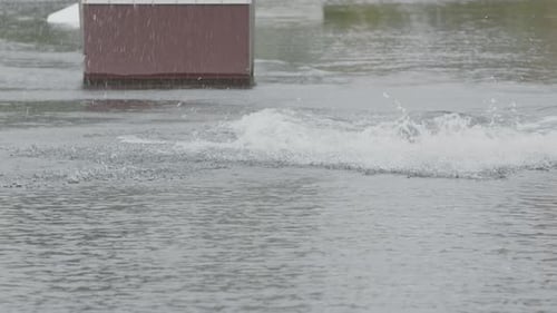 Man Emerging from Water Wearing Helmet