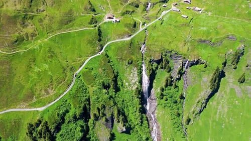 Waterfall In a beautiful Green mountain with Meadows