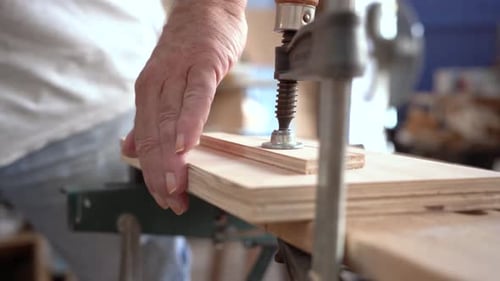 Close Up of a Carpenter Working on Wood Craft at Workspace Producing Wooden Furniturewith