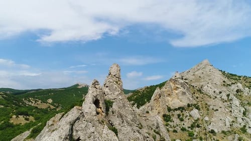 Majestic Rock Formations Dominating the Landscape Under a Blue Sky