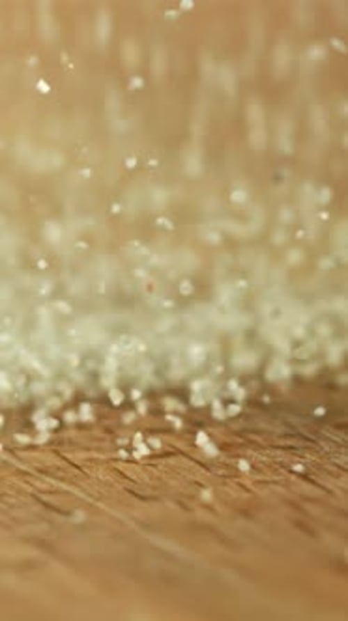 Semolina Falls on a Wooden Table Filmed on a Highspeed Camera at 1000 Fps