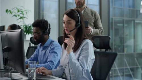Multiethnic Callcenter Teamwork Support Service Caucasian Man Manager Tablet Pointing Screen Headset