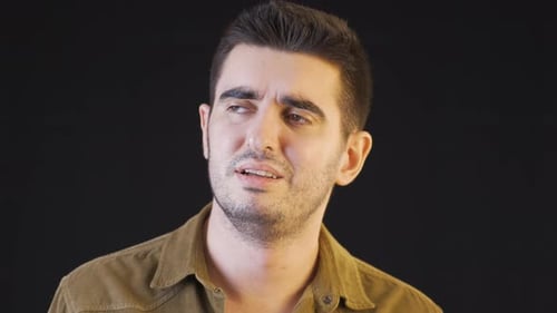 The man is crying, in pain, in loneliness.